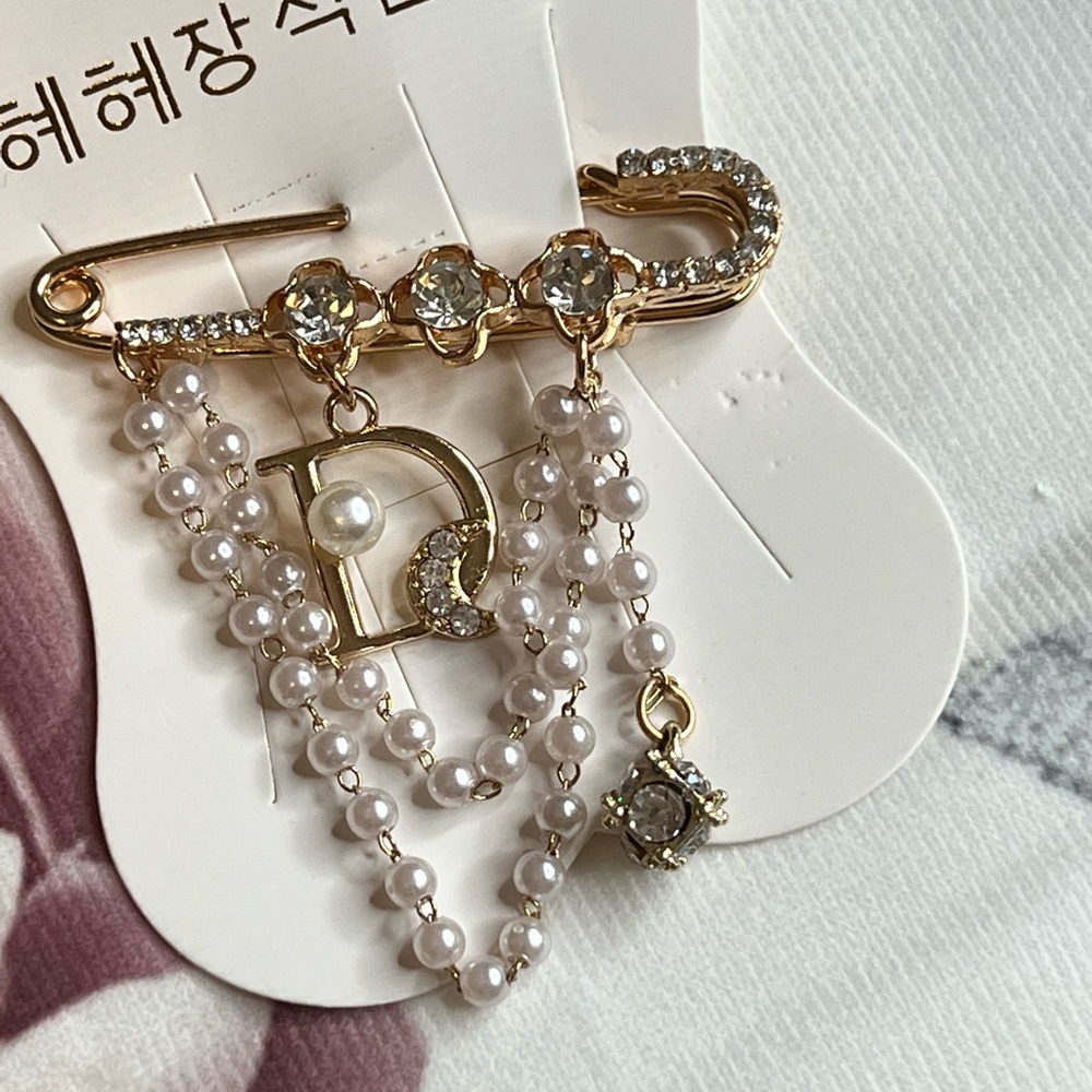 2 for $45. Gold and pearls design brooch.